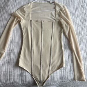 Elegant Cream Long Sleeve Bodysuit with mesh sleeves
